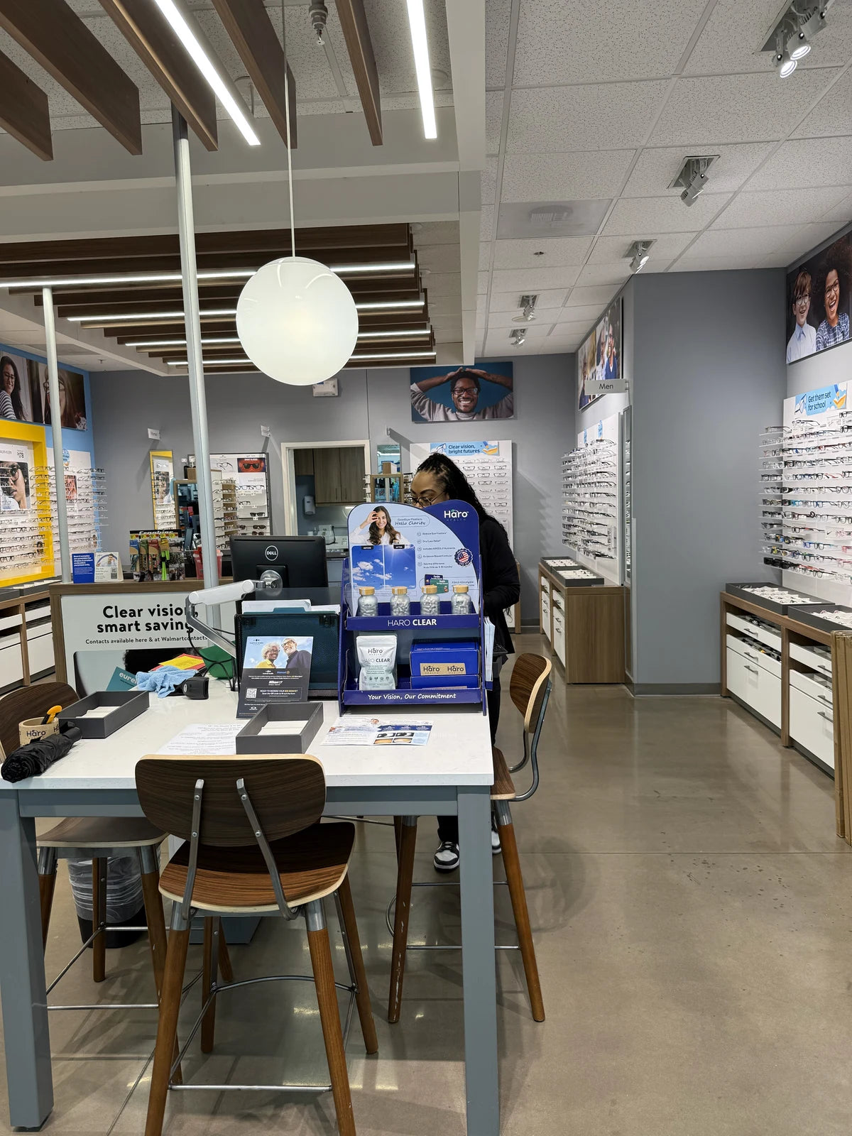 Haro Clear products at a Walmart optical clinic counter with eyewear displays in the background
