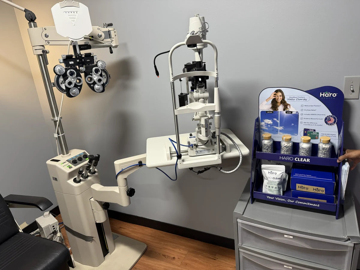 Haro Clear bottles and refill pouches displayed beside eye-examination equipment