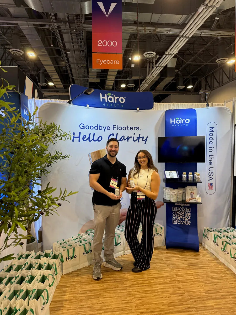 Meeting visitors at the Haro Health booth.