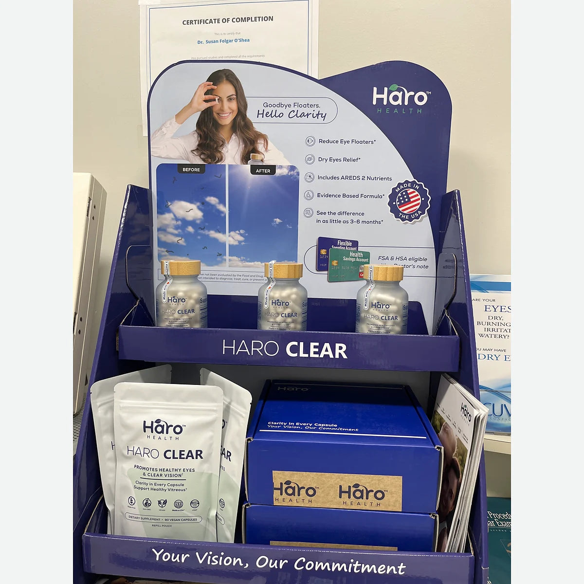 Close-up of a Haro Clear countertop display with bottles and product pouches
