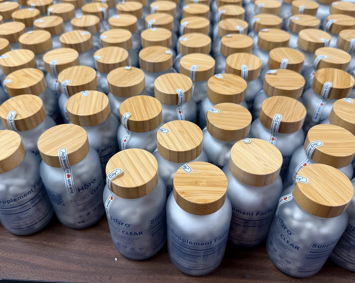 Rows of Haro Clear bottles with wooden lids and tamper-evident seals