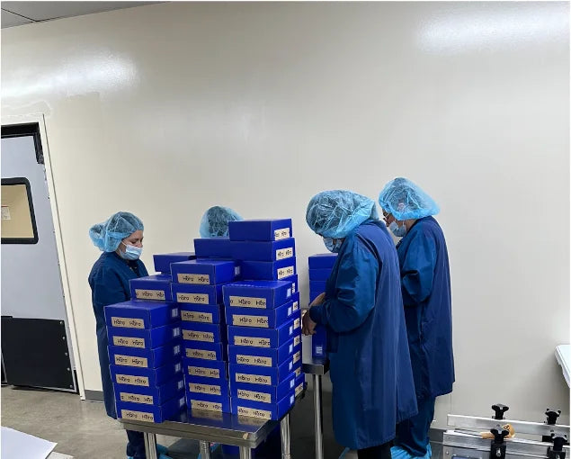 Manufacturing team preparing boxed Haro Clear products